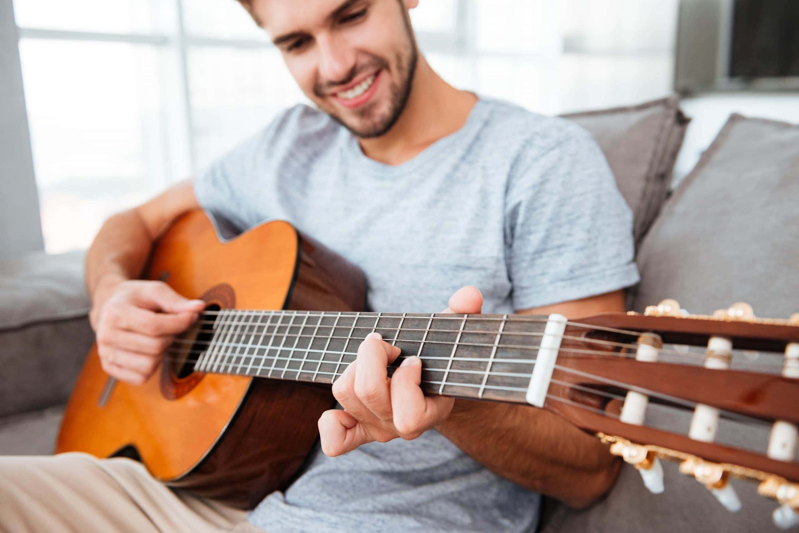 How To Properly Hold A Guitar
